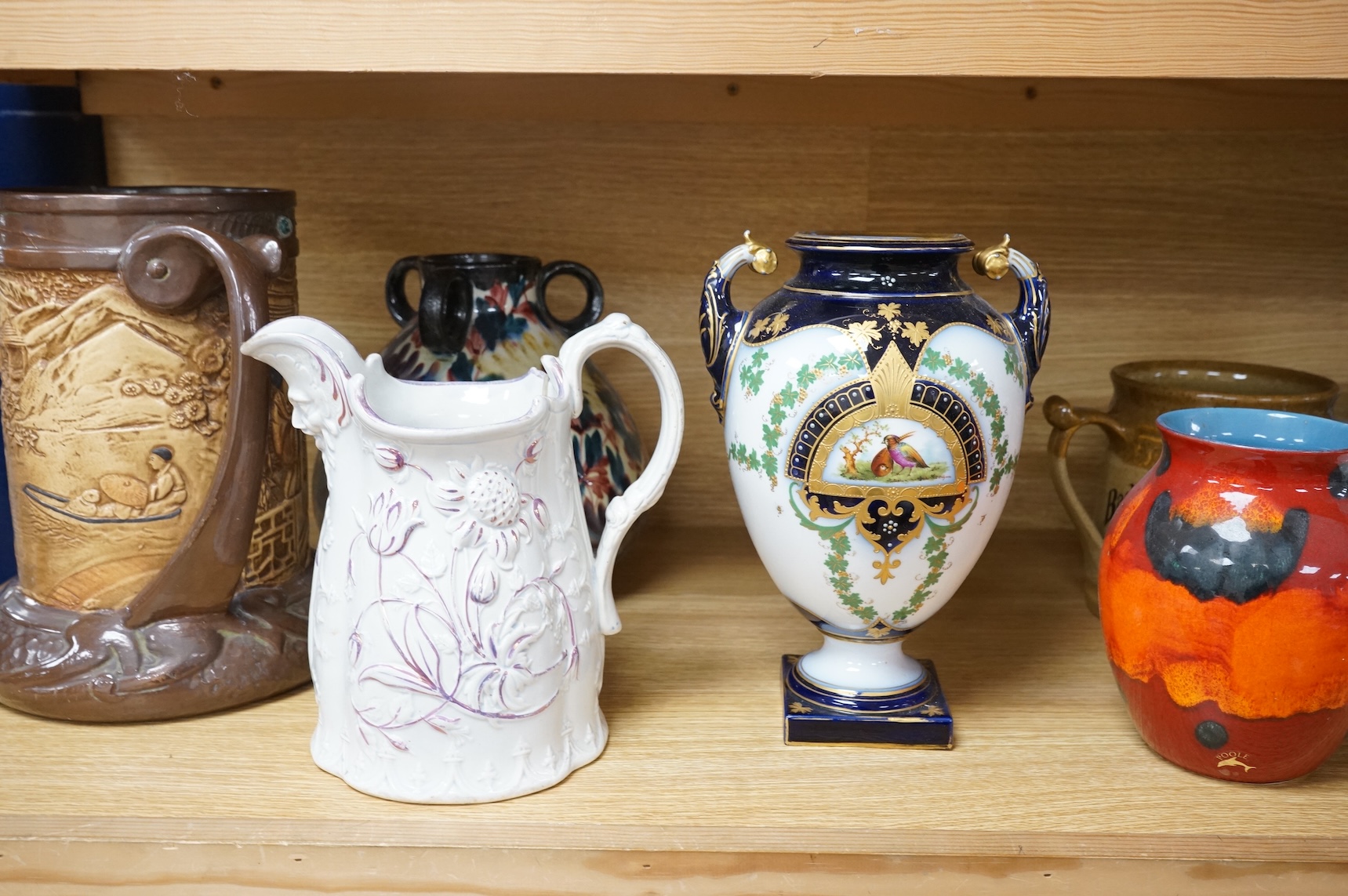 A collection of seven various ceramic vessels including Bretby, Poole, Worcester, continental art pottery etc. 26cm